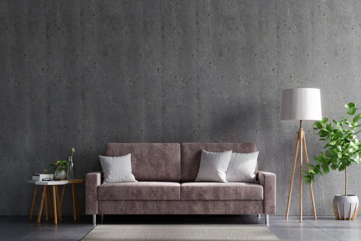 Stylish living room featuring a concrete wall, a plush sofa, and contemporary decor elements.