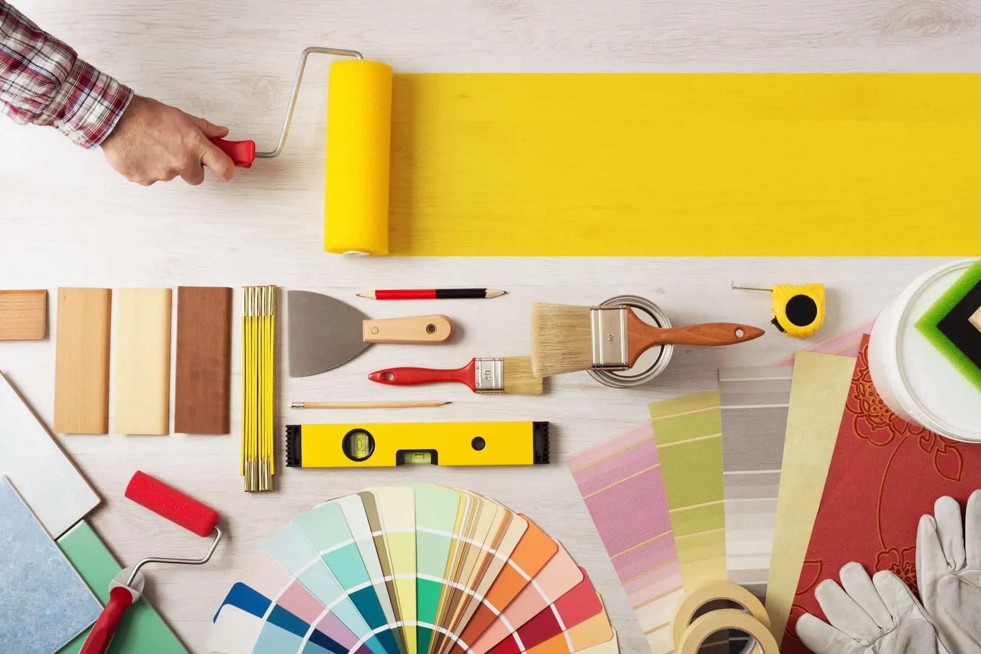 Painting tools and color swatches for home decorating projects.